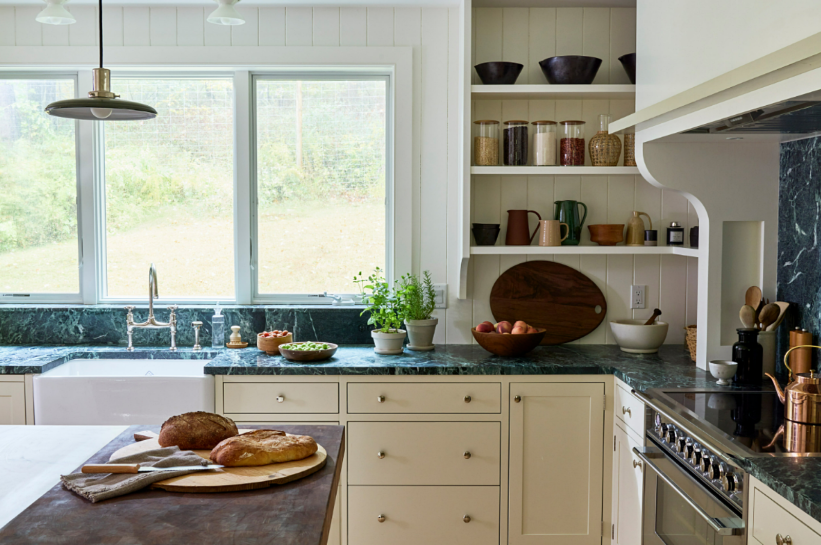 kitchen with cream cabinets and green countertops