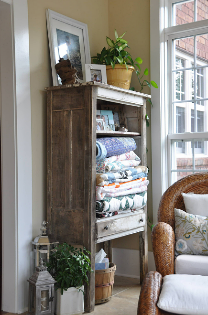 cabinet filled with colorful quilts