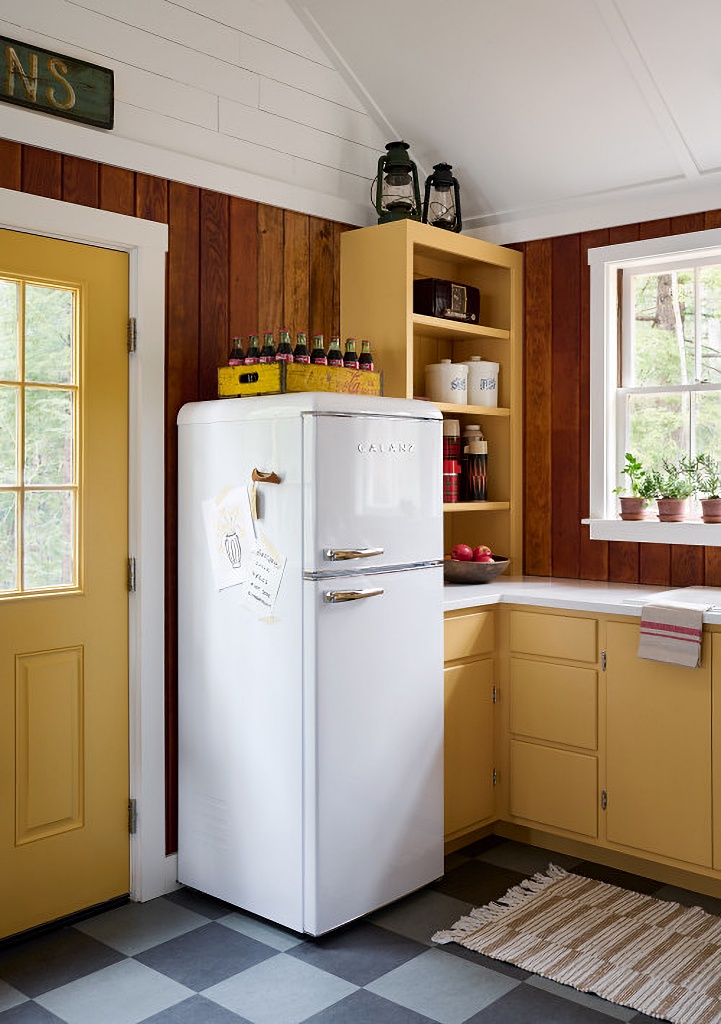 vintage cabin style kitchen with golden cabinetry