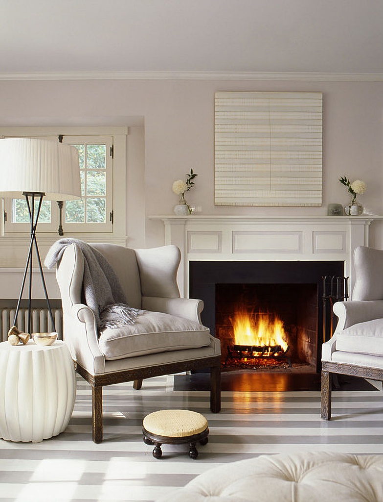 wing back chairs near fireplace
