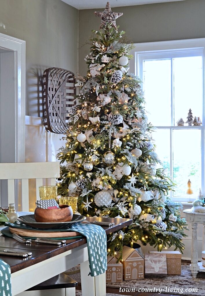 white ornaments on green tree