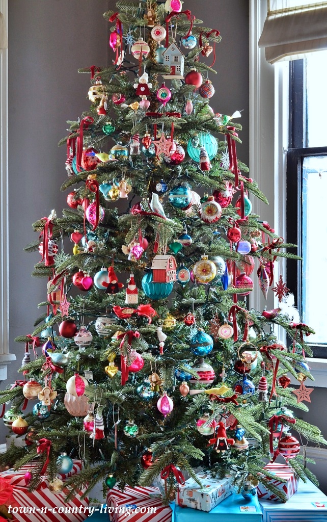 Christmas tree overloaded with vintage ornaments