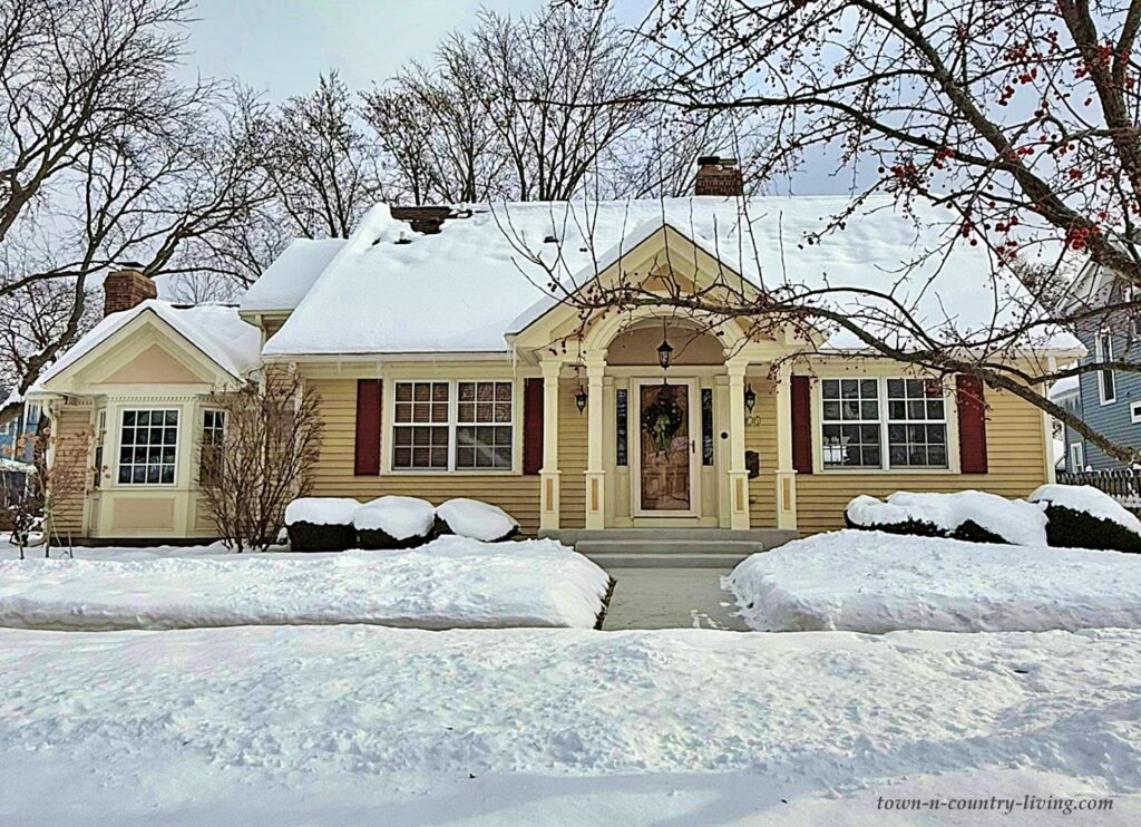 yellow bungalow in the snow
