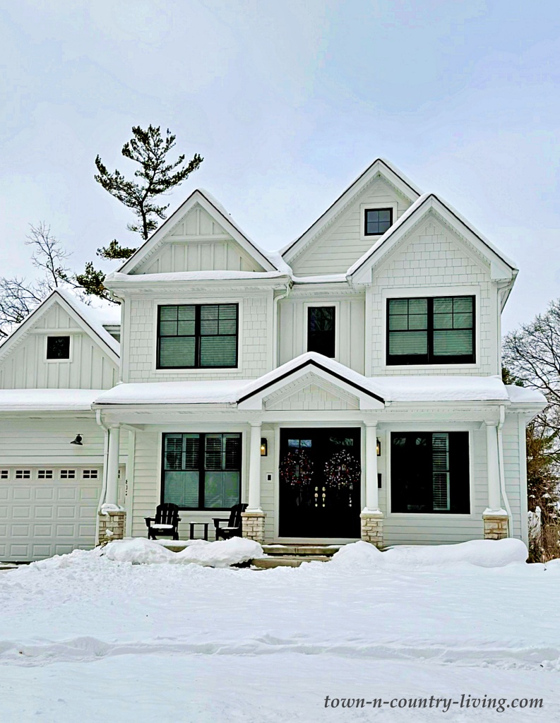 white farmhouse in winter