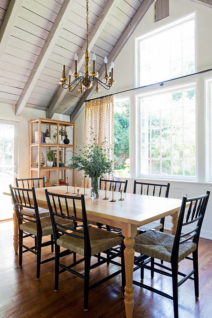 vaulted ceiling and stacked unique windows in dining room