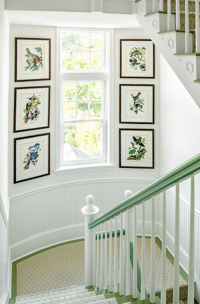 sunny staircase landing with artwork