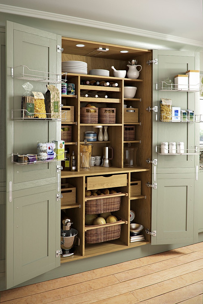 neatly organized kitchen pantry with drawers and baskets