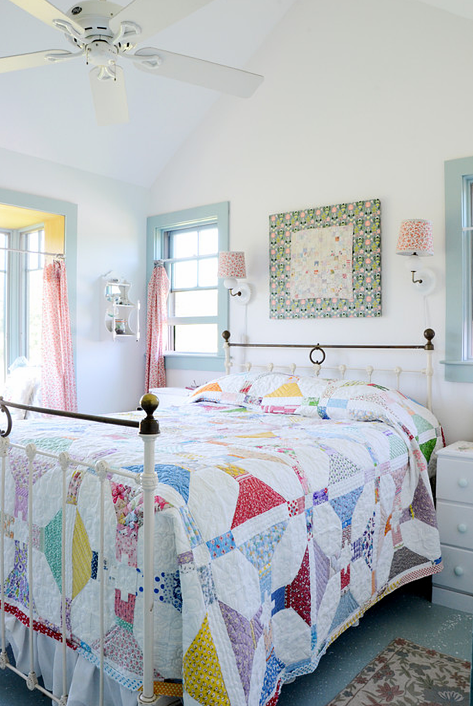 handmade quilt on metal bed