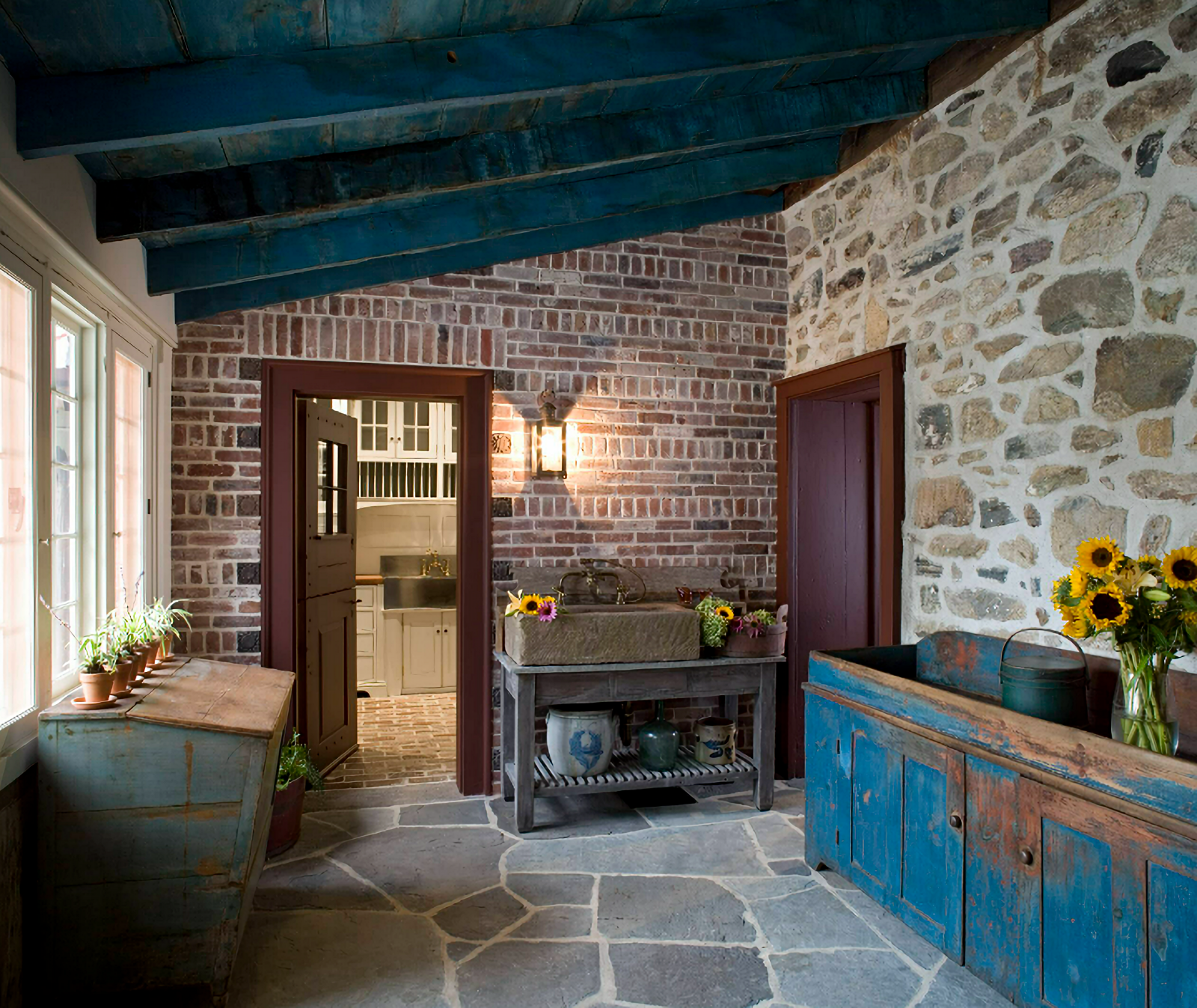 stone house - rustic sunroom