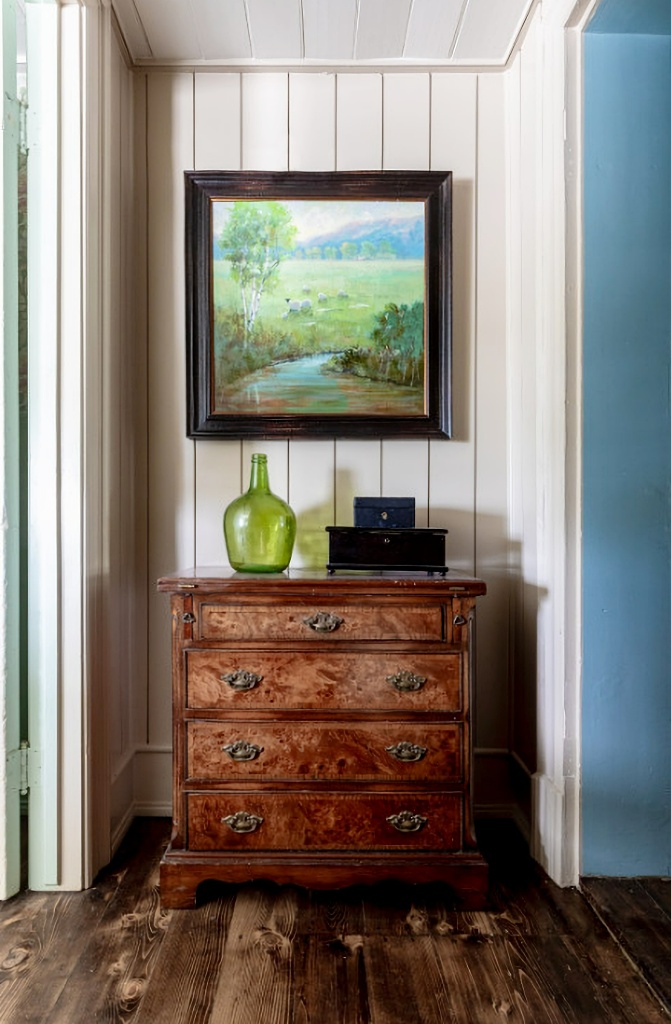 wood dresser tucked in hallway nook