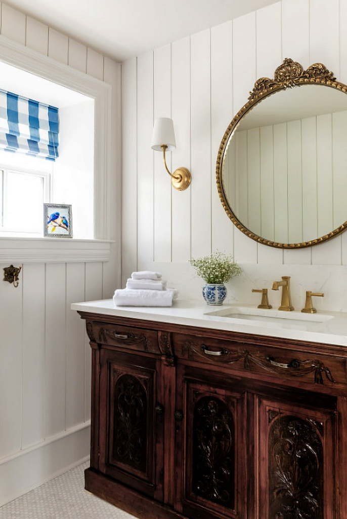 antique vanity and mirror in cottage bathroom