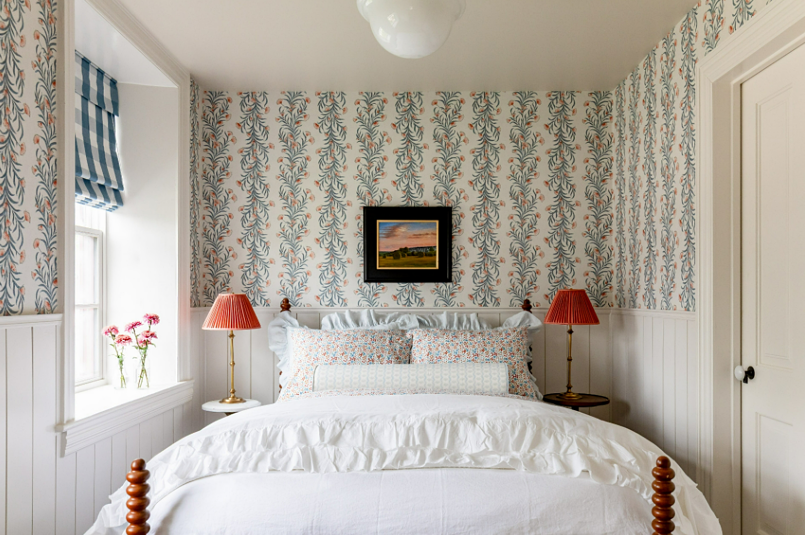 cottage style bedroom with floral wallpaper and white bedding