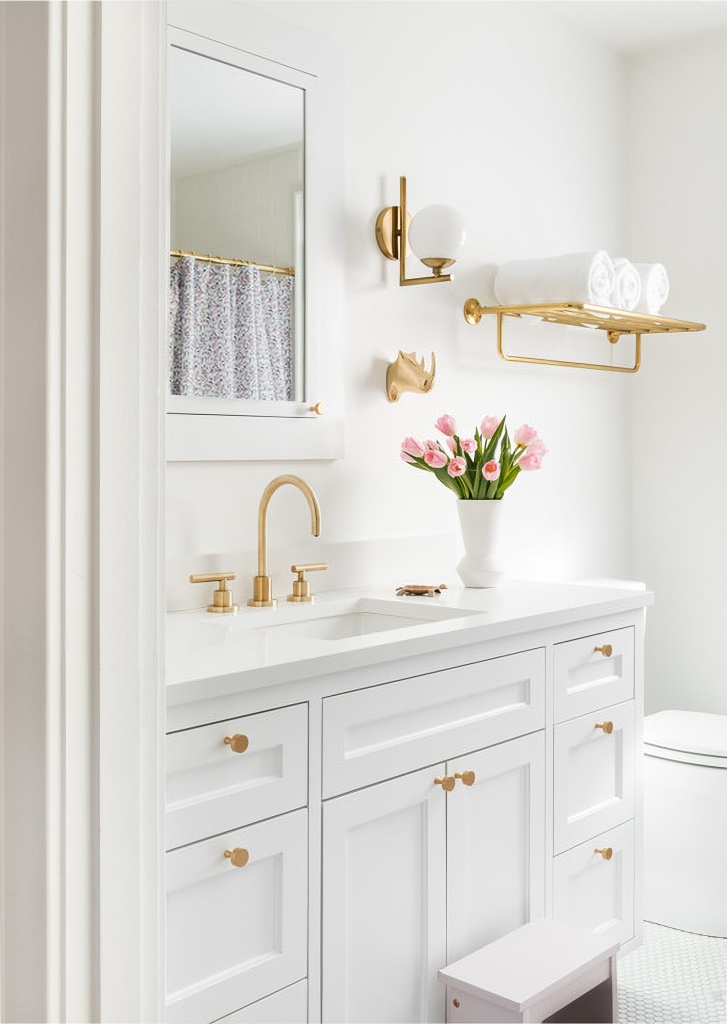 white bathroom with gold accents