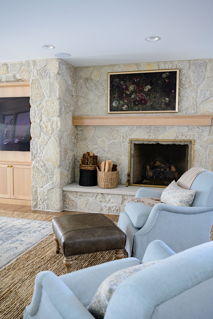 blue living room with stone fireplace