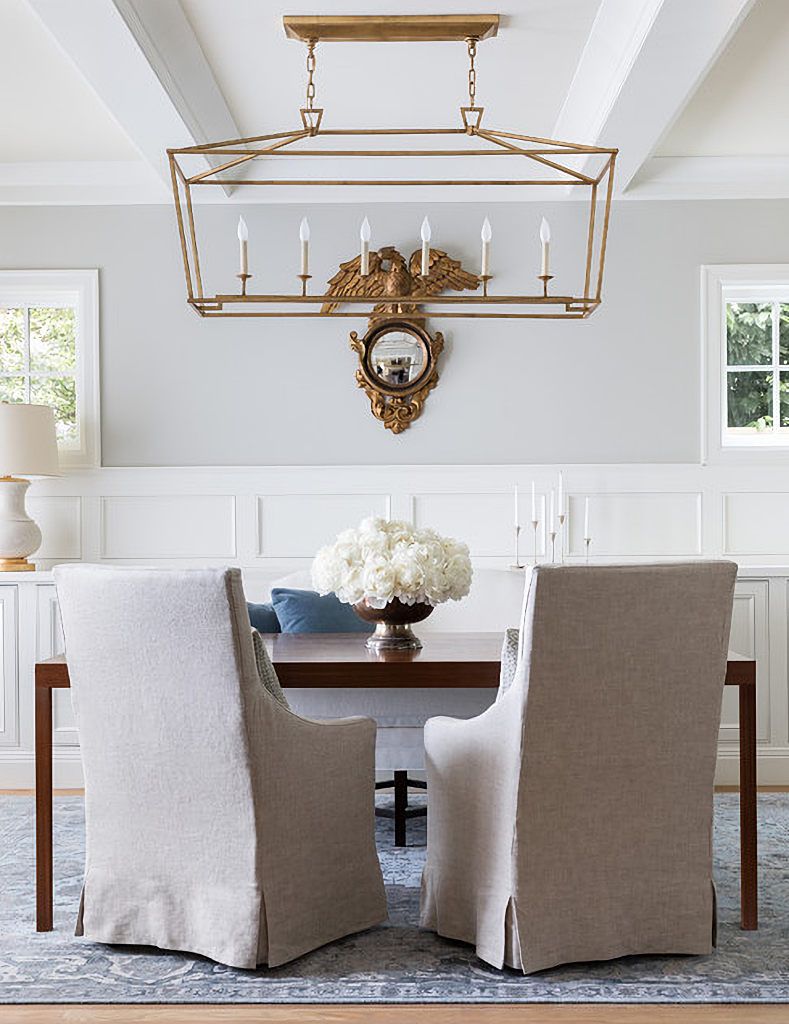 neutral dining room with slipcovered chairs