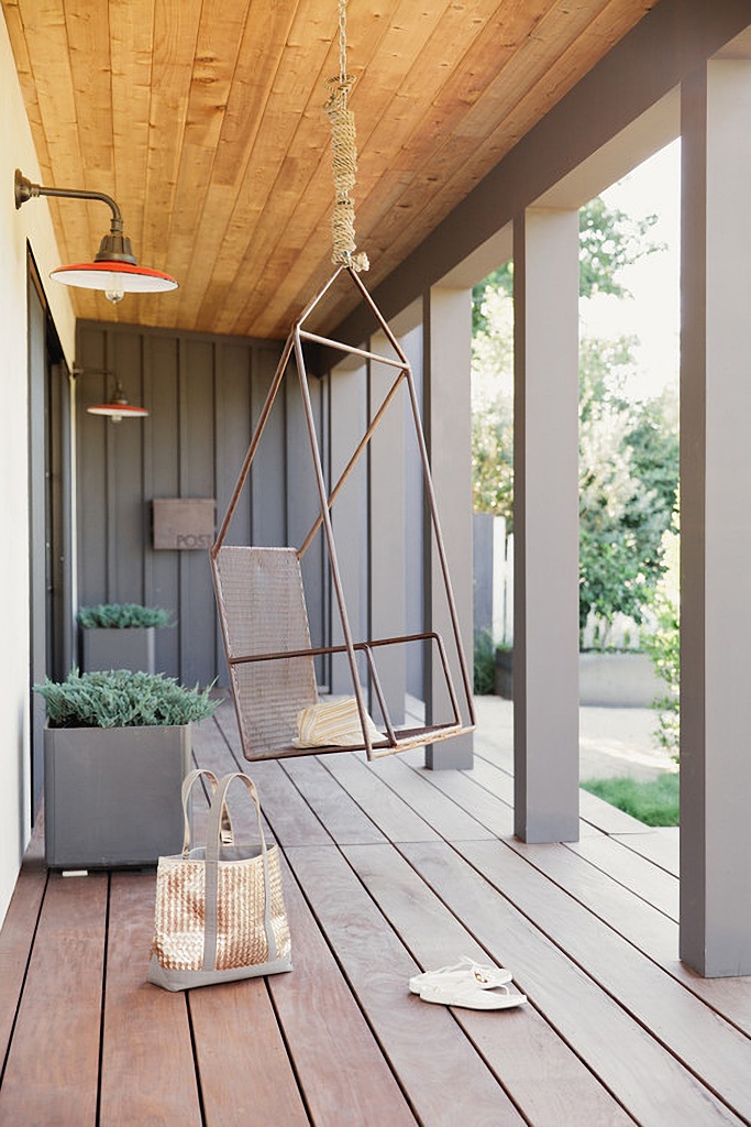 modern version of a singular swing on a porch
