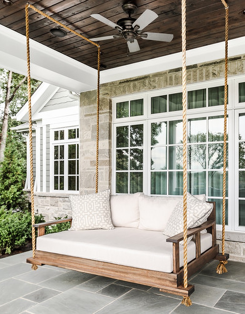 large swing on a stone porch