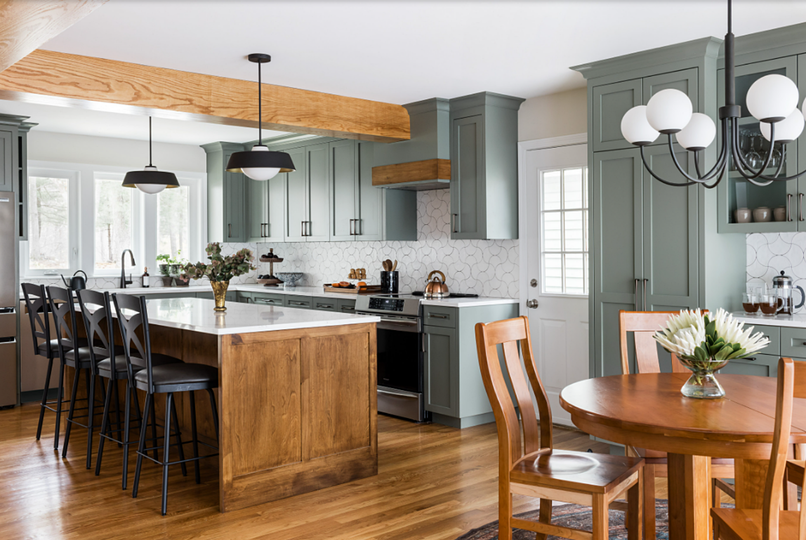 renovated kitchen with sage green cabinets