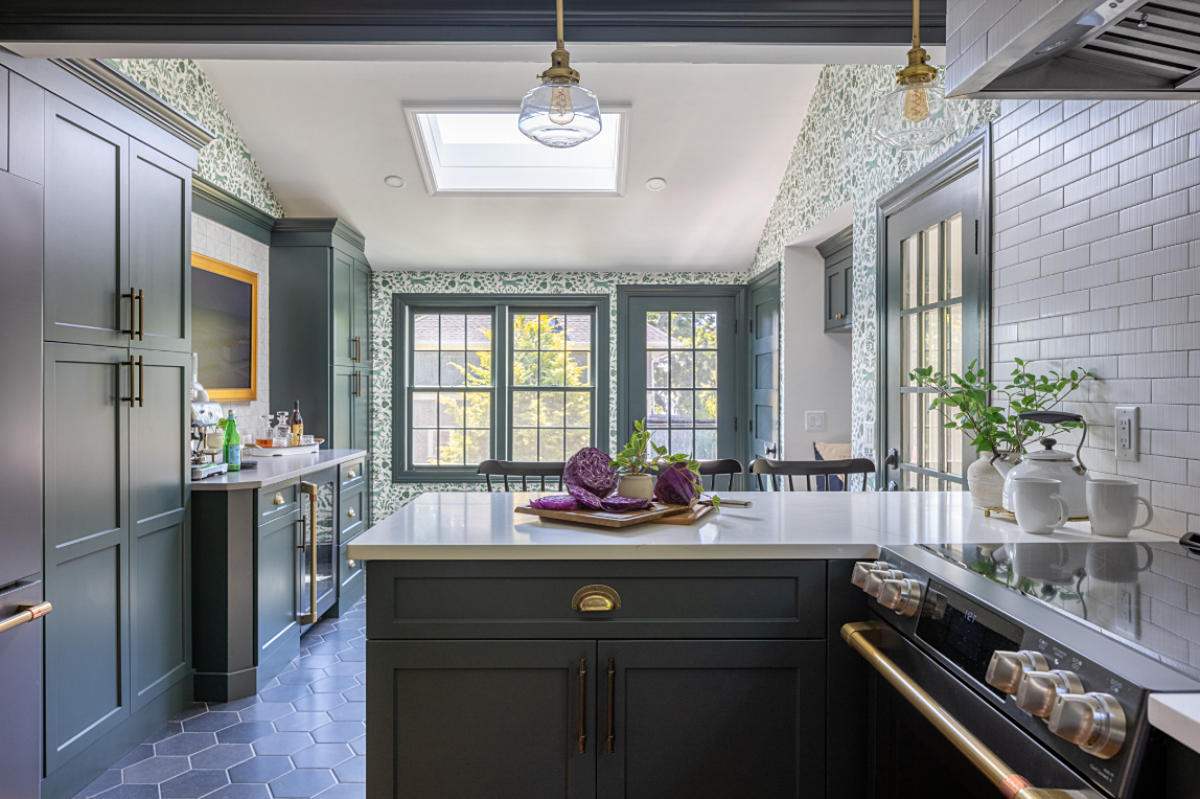 cozy kitchen with dark green cabinetry