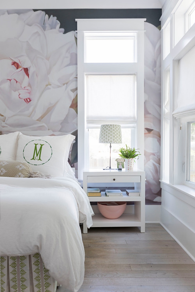 oversized floral mural behind bed