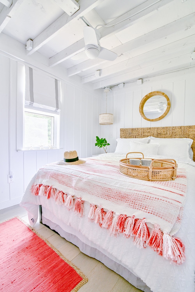 white and coral beach style bedroom