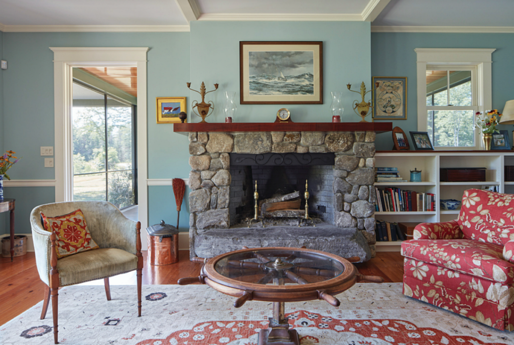 traditional living room with stone fireplace
