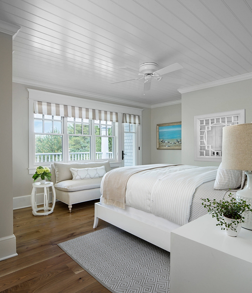 neutral bedroom with waterfront views