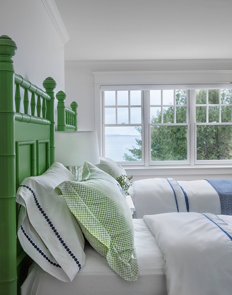 green bamboo bed in guest room