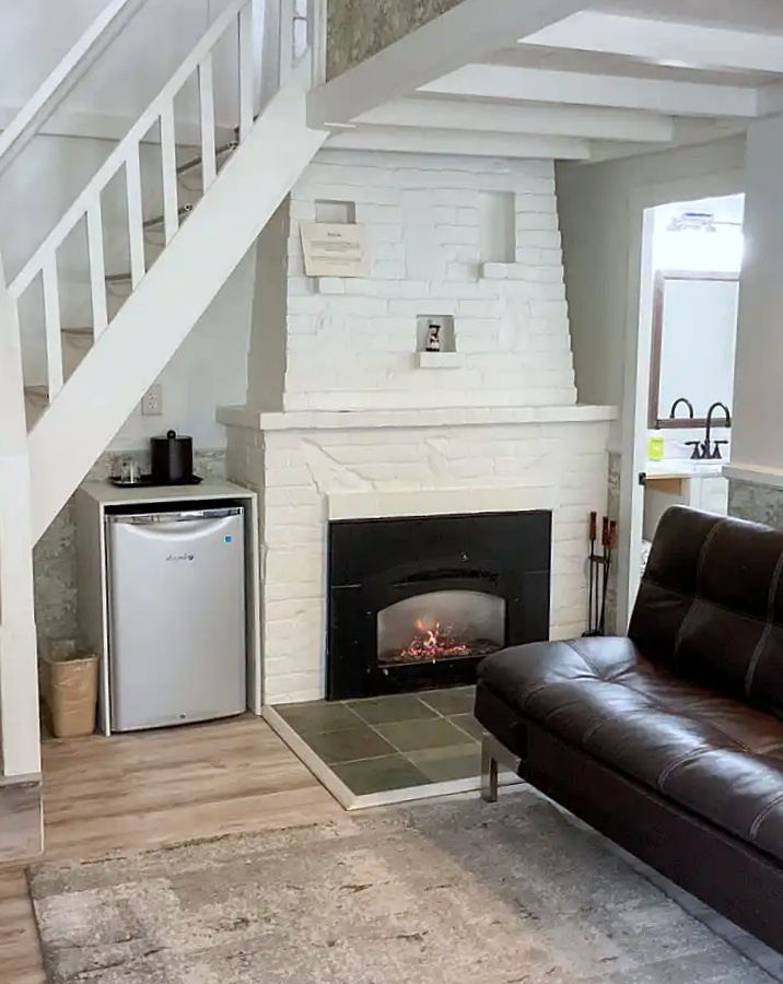 cozy cottage fireplace at Green Lantern Inn
