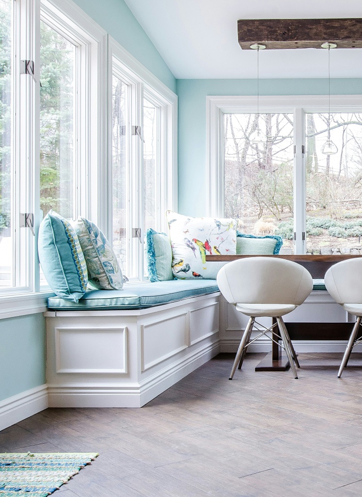 aqua and white sunroom with banquette