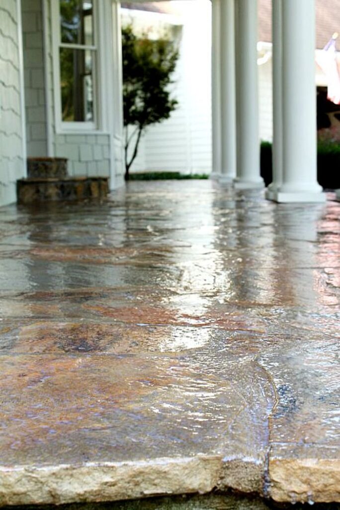 applying sealer on stone