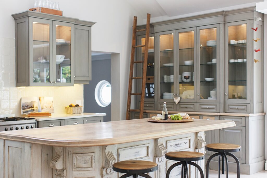 gray cabinets with large island in kitchen