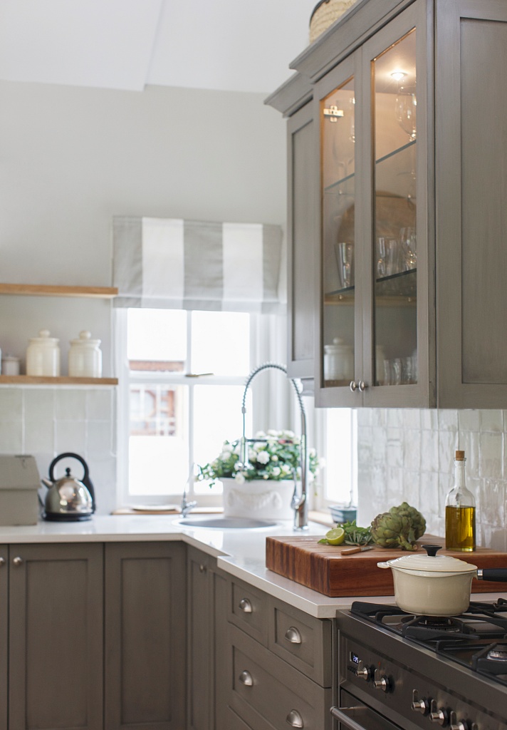 warm gray cabinets in classic kitchen