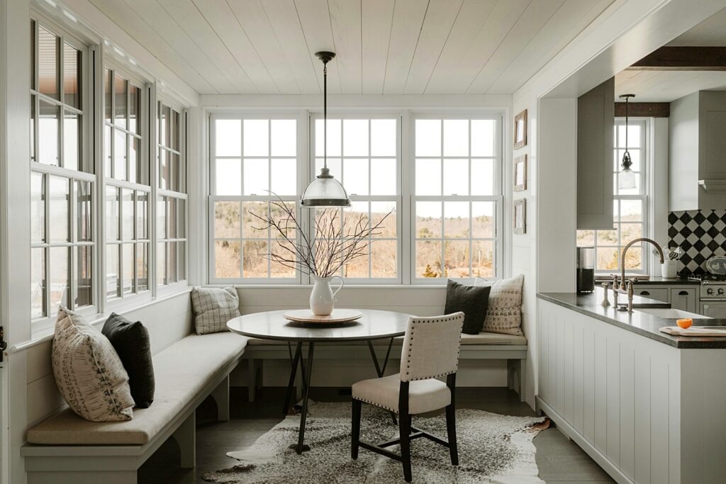 sunny breakfast nook adjacent to modern farmhouse kitchen