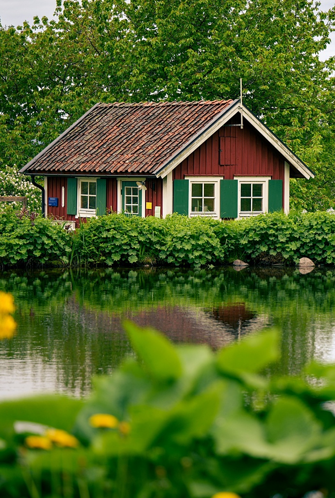 tiny red cottage by the lake