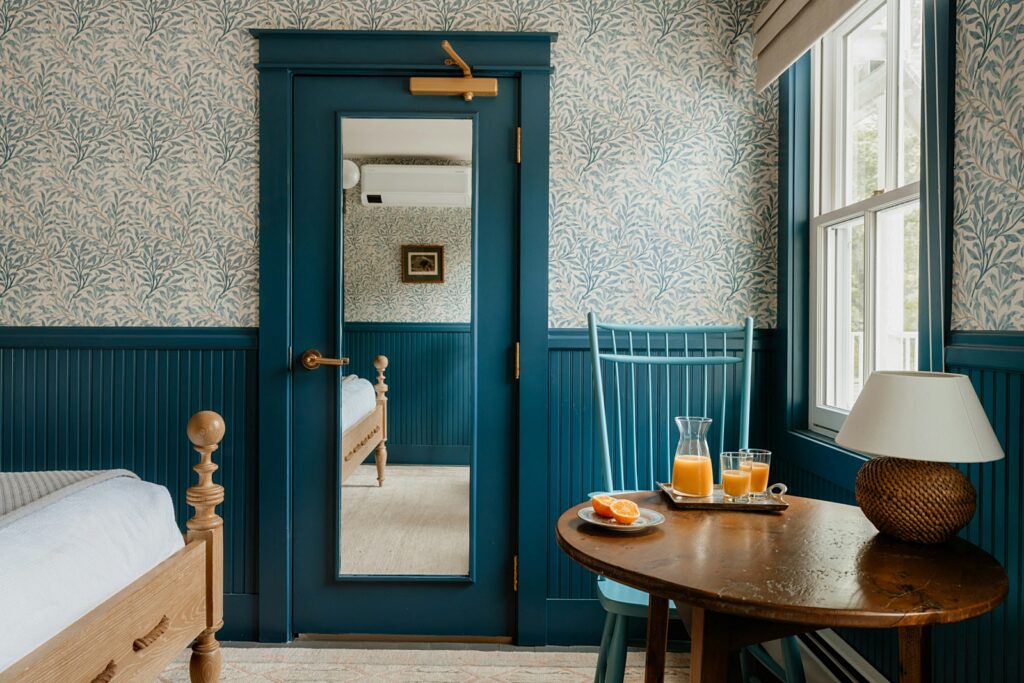 teal bedroom with cozy wallpaper