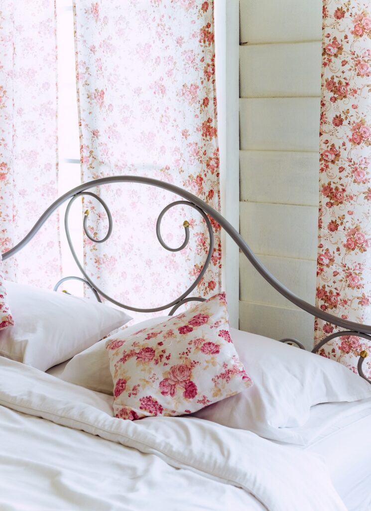 pretty window treatments in a cottage bedroom