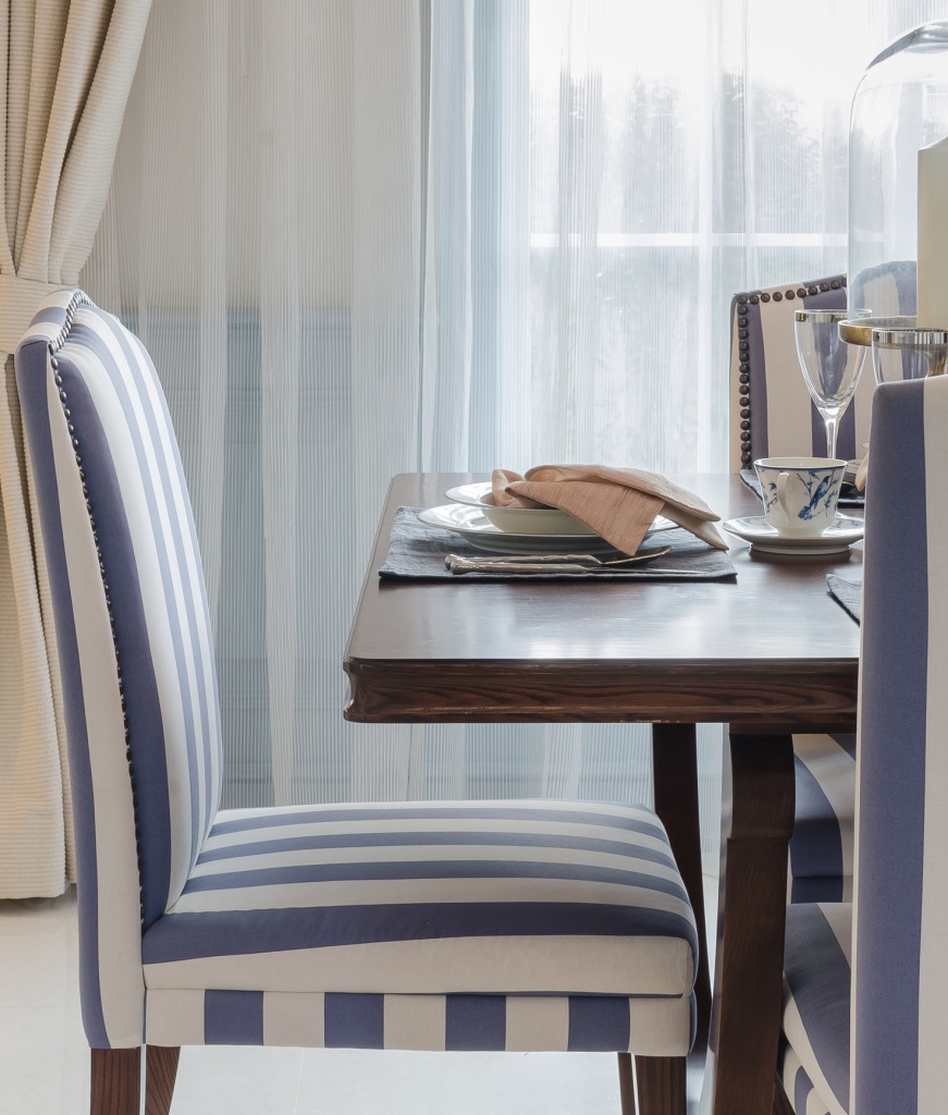 formal dining room with pretty window treatments