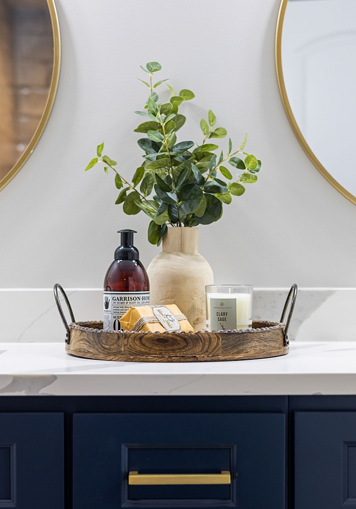 tray of essential and decorative items in bathroom
