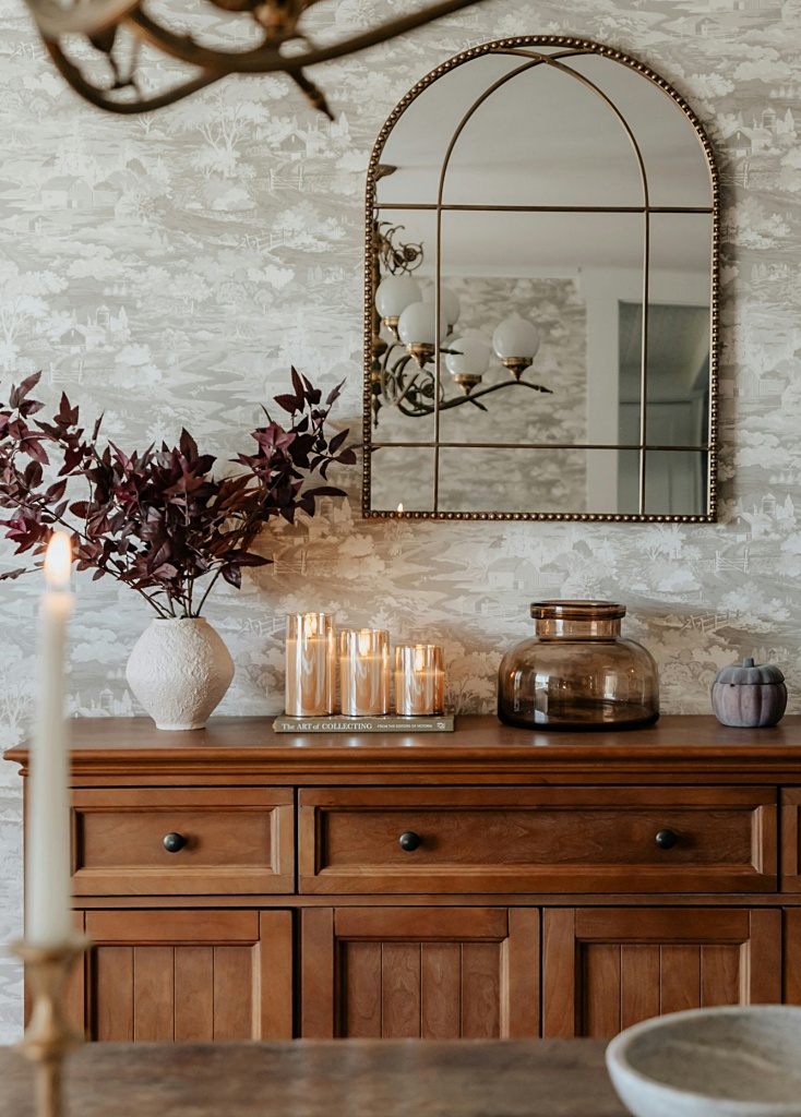 warm dining room with creative vignette on buffet