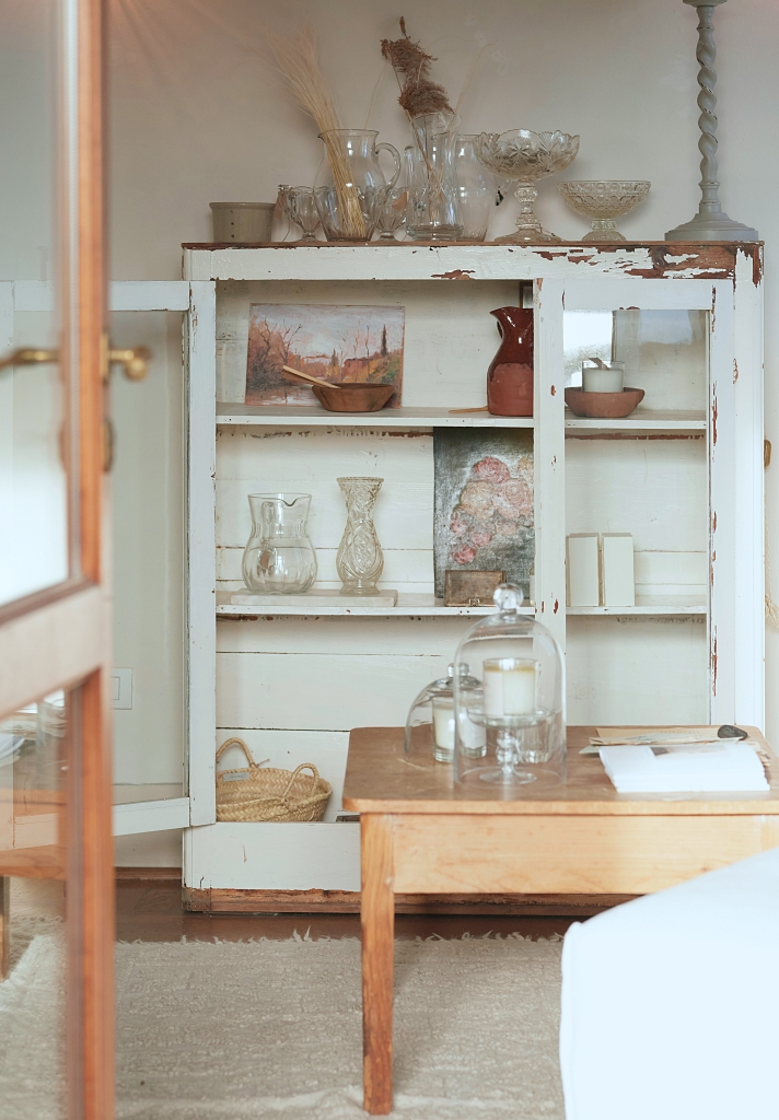 vintage cabinet filled with glassware