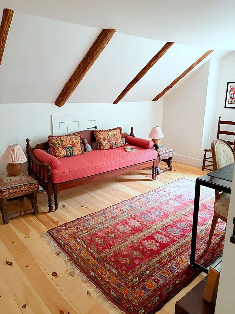 red daybed in home office