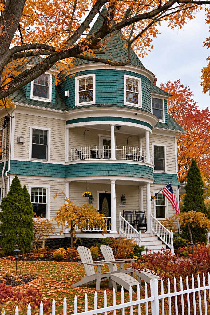 Victorian home with turret in fall season